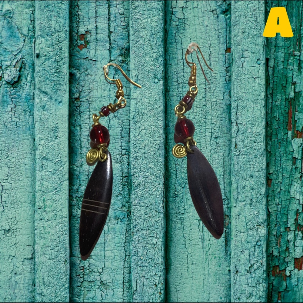 Handmade in Kenya. NOTE: Please choose each earring according to letters.